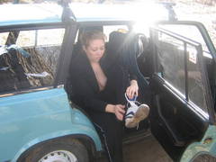 My plump exwife showing her nude body sitting on my car. Image 5